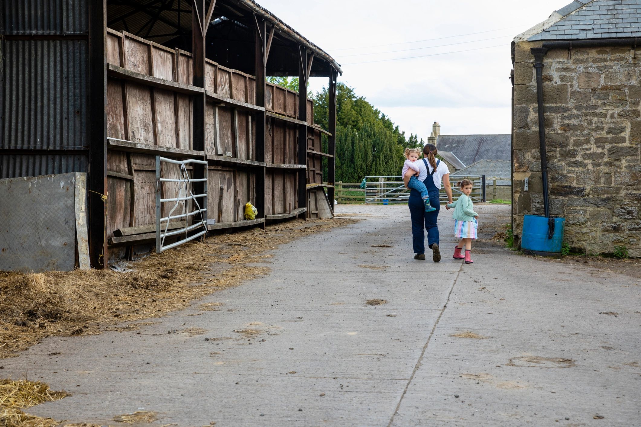 Family walking together on a farm